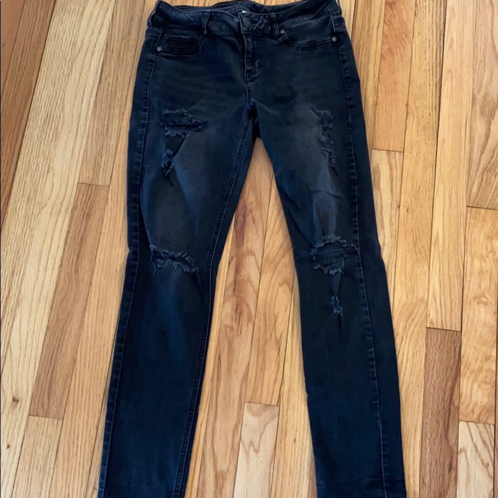 Black distressed jeggings.